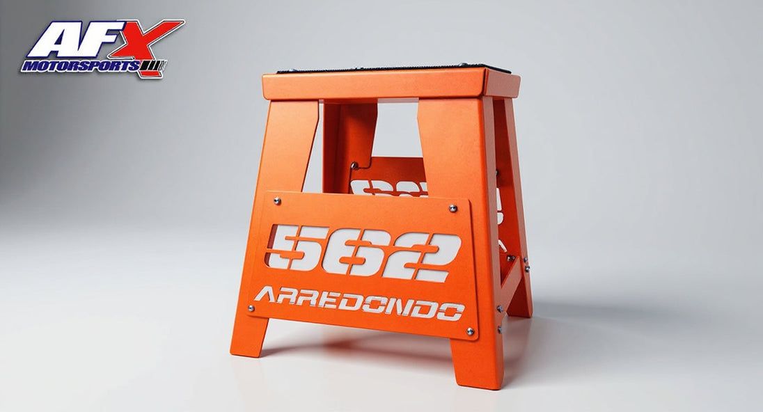 Orange step stool with 'AFX' and '5622 Aredondo' branding on a gray background